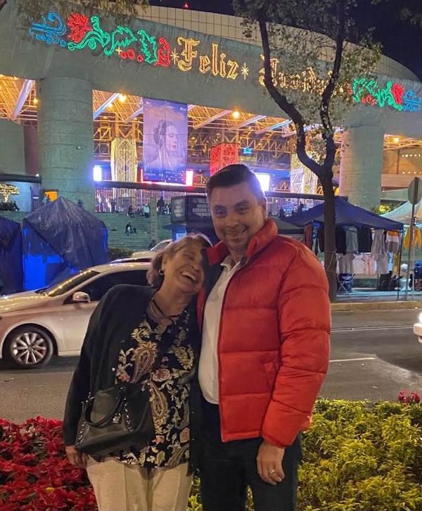 Carlos Moscot with his mom at a holiday celebration